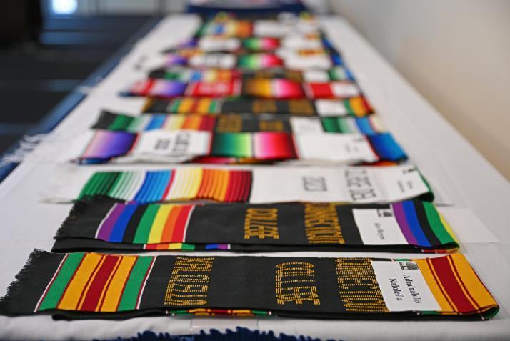 Stoles ready for students at Commencement on a table