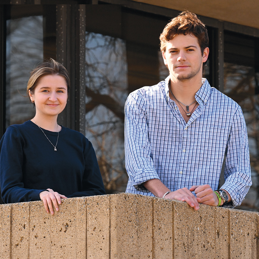 Olha Vasyliv ’23 and Ethan Bankowski ’24 pose outside the library