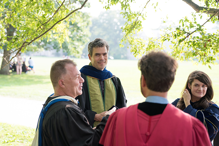 Faculty members catch up after the summer break. 