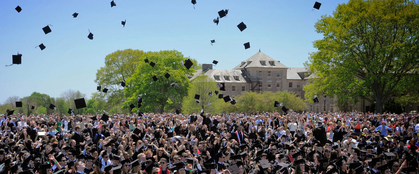 Graduates toss their caps at Commencement.