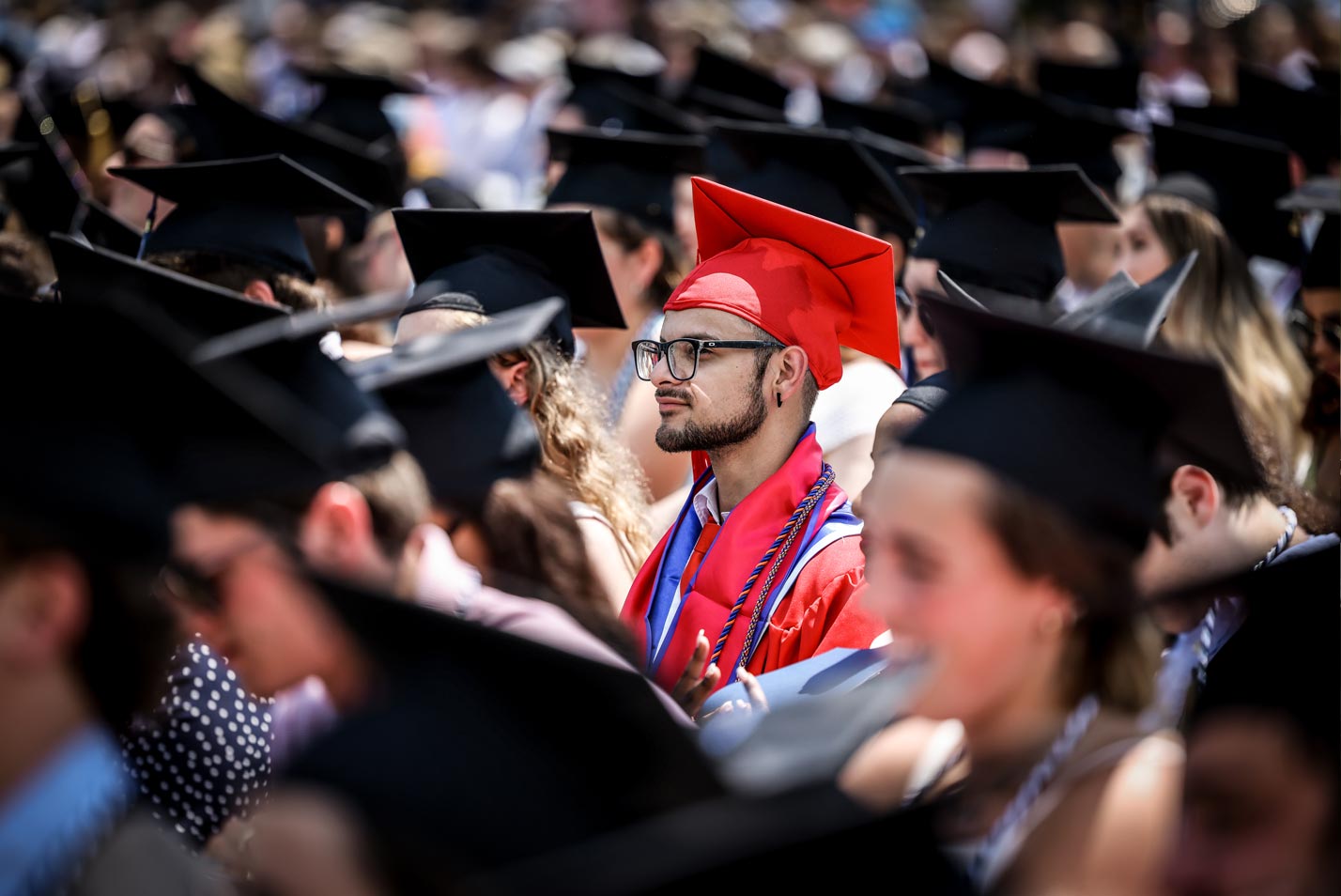 A graduate watches the proceedings