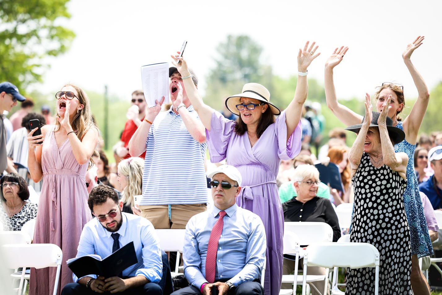 Family members cheer for their loved ones