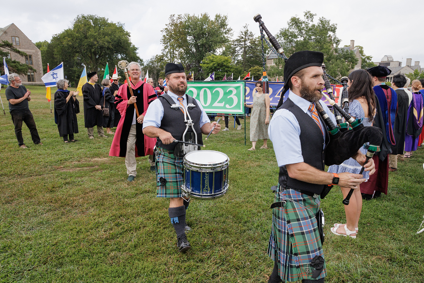 The Manchester Pipe Bands leads the procession.