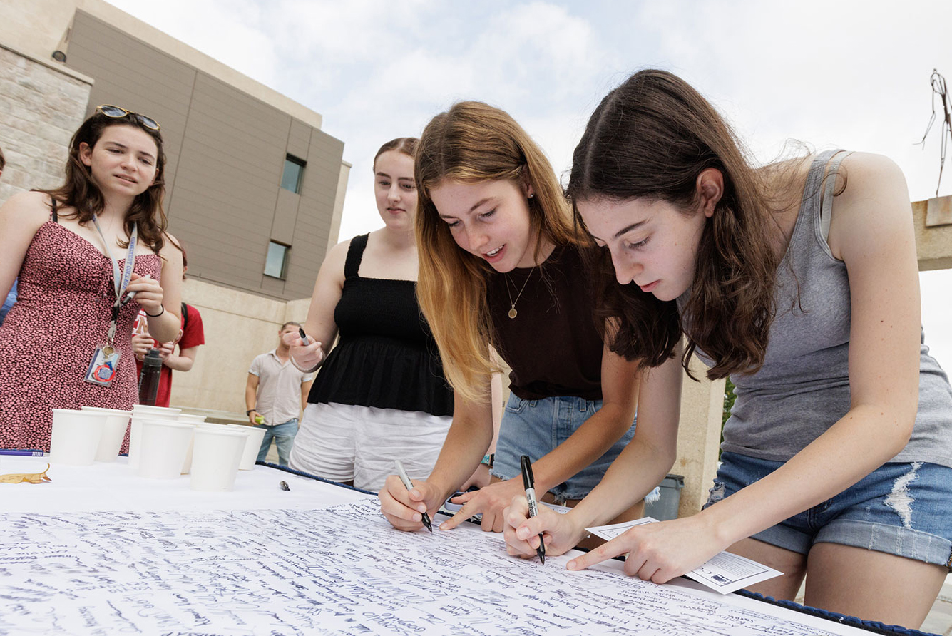 New students sign the Honor Code Pledge.