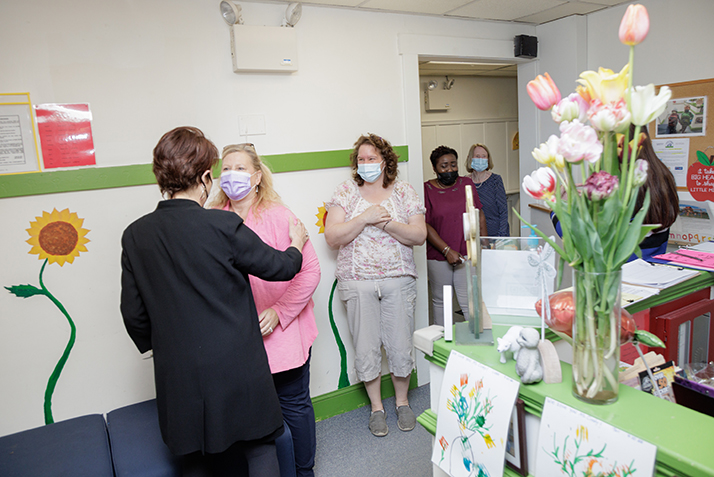 Teachers from the Lab School are surprised by President Katherine Bergeron.