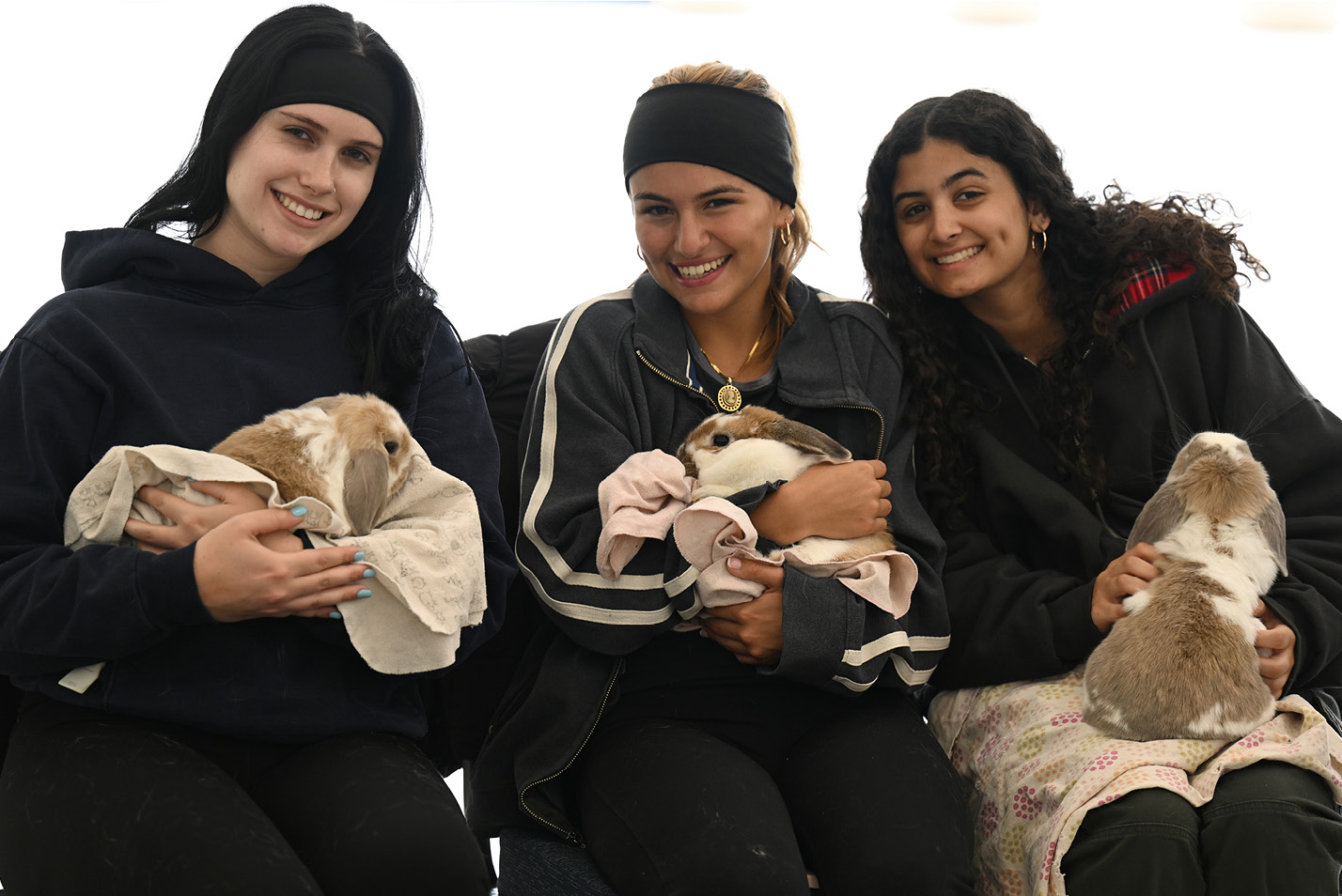 Students play with animals on campus to de-stress at a petting zoo from Warm and Fuzzy Animal Adventures Wednesday, April 19, 202