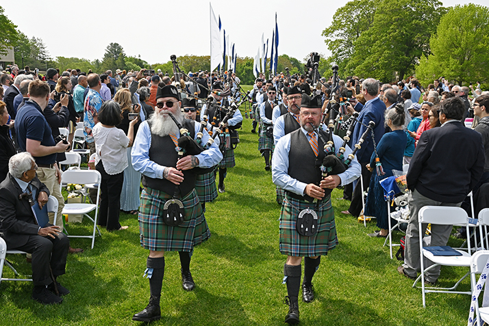 Bagpipers lead the procession