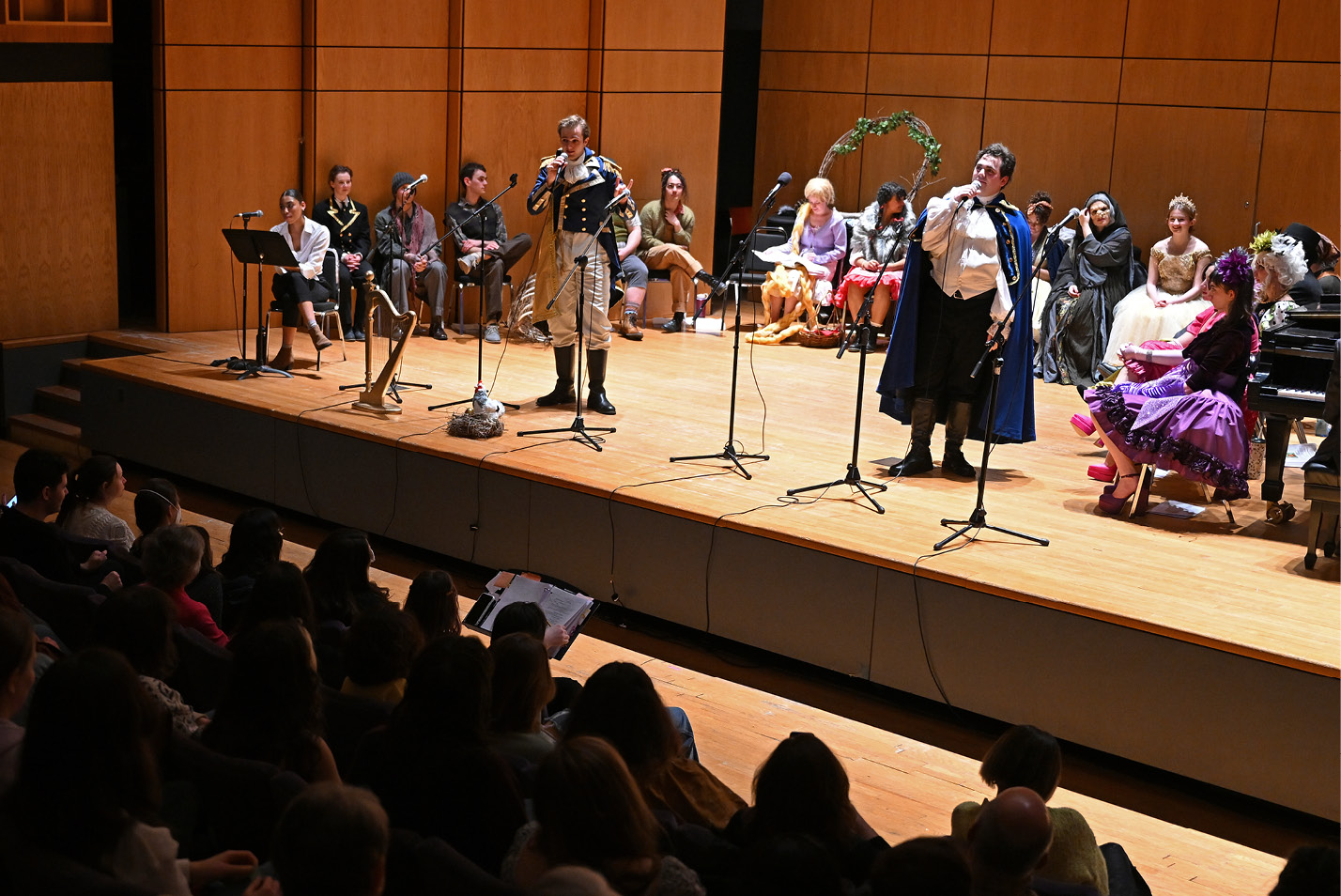 Josh Moylan '23, right, as Rapunzel’s Prince, and James Nalle '23, as Cinderella’s Prince, perform “Agony” as the cast looks on.