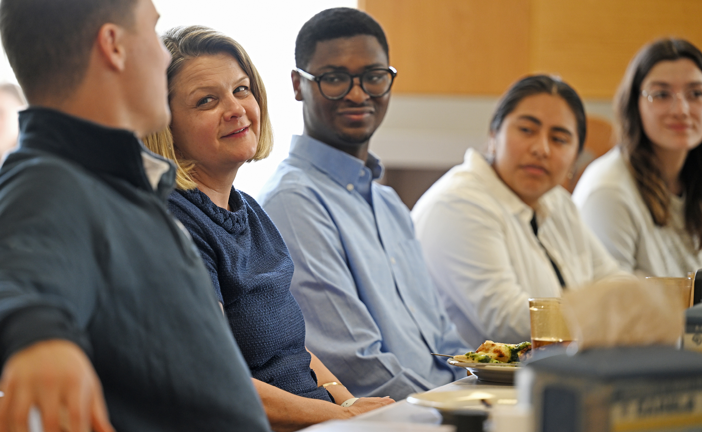 President Chapdelaine, second from left, talks with students during lunch.