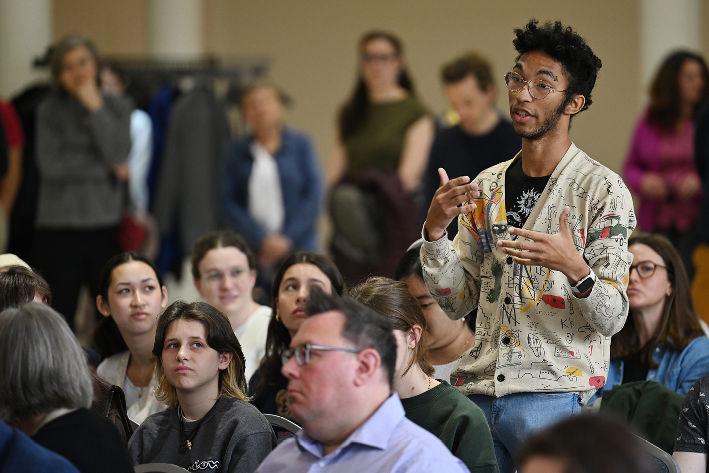 A student asks Chapdelaine a question during the community meeting.