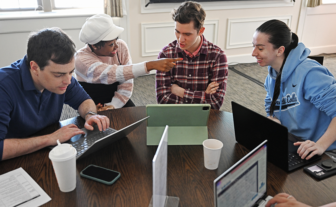 Visiting Assistant Professor of History Taylor Dislodge, left, works with Brianna Clay ’27, Williams School junior Jacob Bates, and Charlotte Steinhauer ’27, as students gather in the Hood Dining Room in Blaustein Humanities Center for the Frederick Douglass Day annual Transcribe-a-thon Wednesday, February 14, 2024.