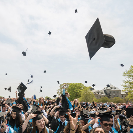 Graduation caps in the air